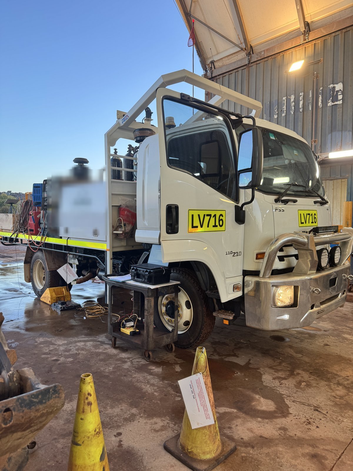 Isuzu service truck in the workshop bay